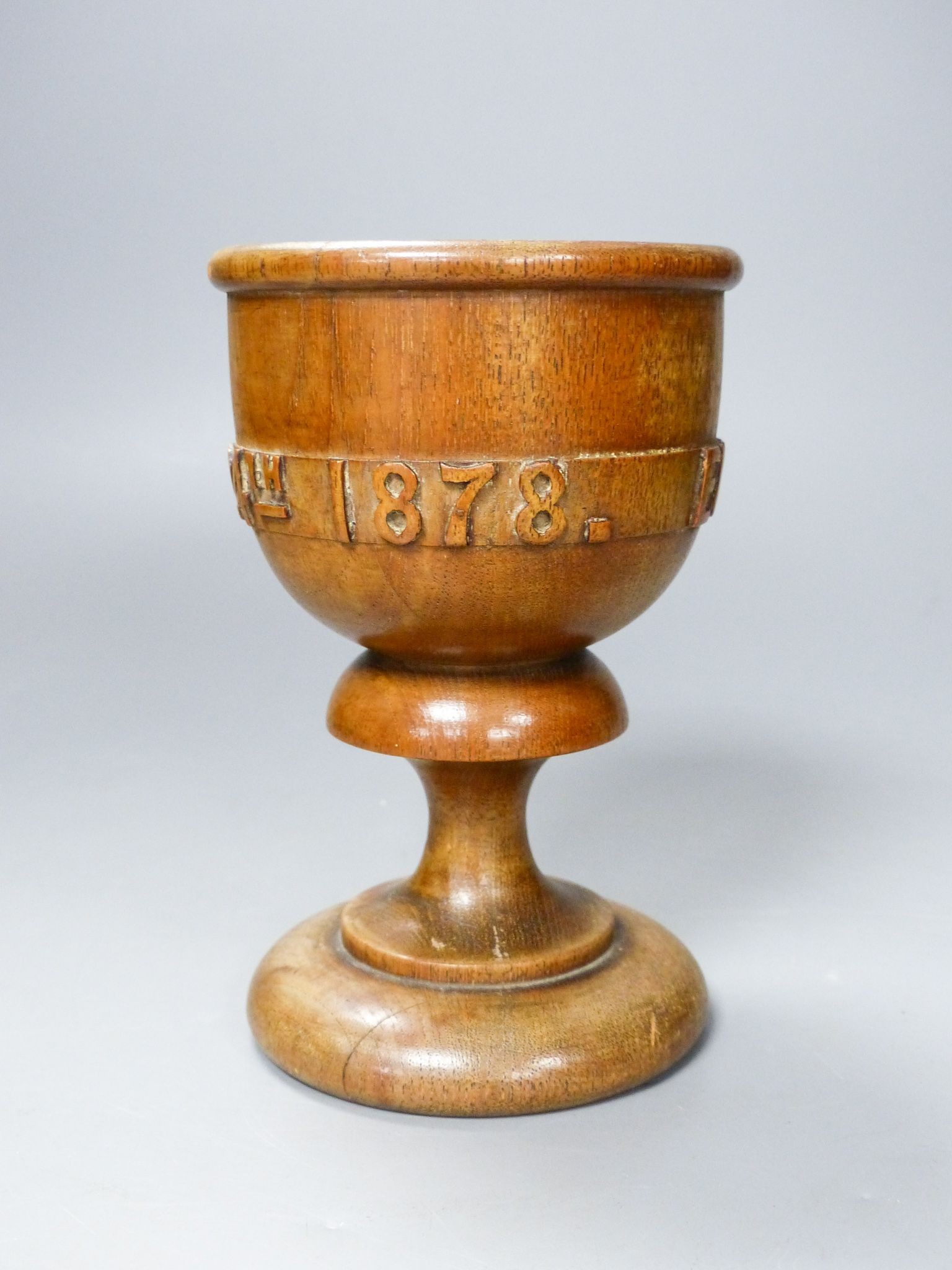 A turned and carved wood goblet made from the timber of the ship Eurydice and dated March 24th 1878, 15cm 15cm